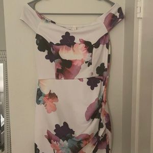 Off the shoulder asymmetrical dress.Floral pattern